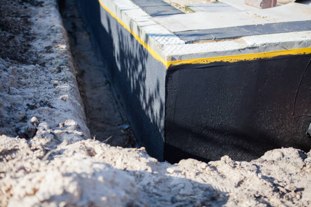Professional Waterproofing technician working in Thorn Hill, TN